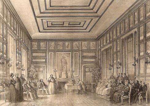 La SFA en 1849 : Séance de la Société française pour la conservation des monuments (future Société française d’archéologie), à Bayeux, en février 1849 dans la galerie de l’évêché. Lithographie de Mercier (d’après un dessin de Bouet) extraite du T. XV du Bulletin Monumental (1849).
